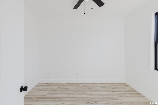 unfurnished room featuring ceiling fan, light wood finished floors, and baseboards