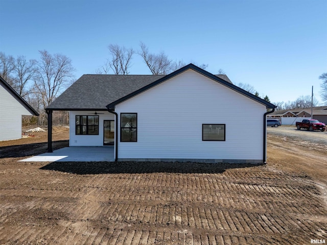 rear view of property featuring a patio area