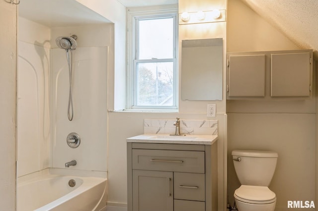 bathroom with vanity, toilet, and shower / bathtub combination