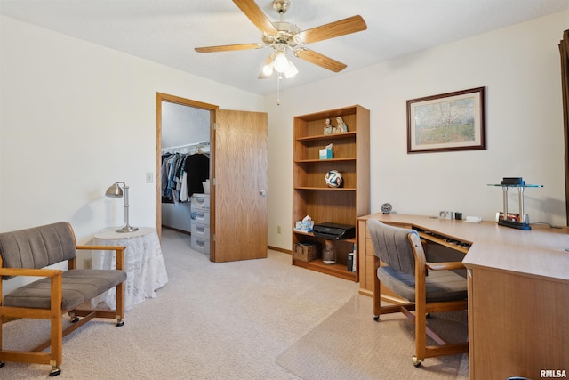 office with light carpet and a ceiling fan