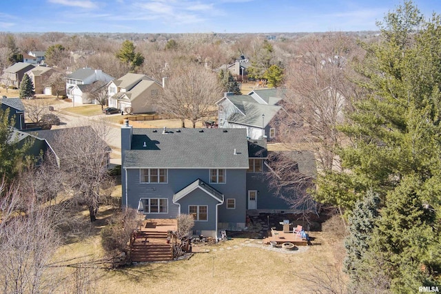 birds eye view of property with a residential view