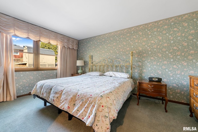 bedroom with wallpapered walls, carpet, and baseboards