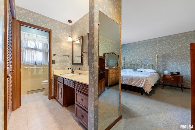 full bathroom with wallpapered walls, toilet, vanity, and ensuite bathroom