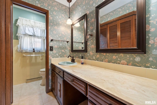 bathroom featuring wallpapered walls, tile patterned floors, toilet, and vanity