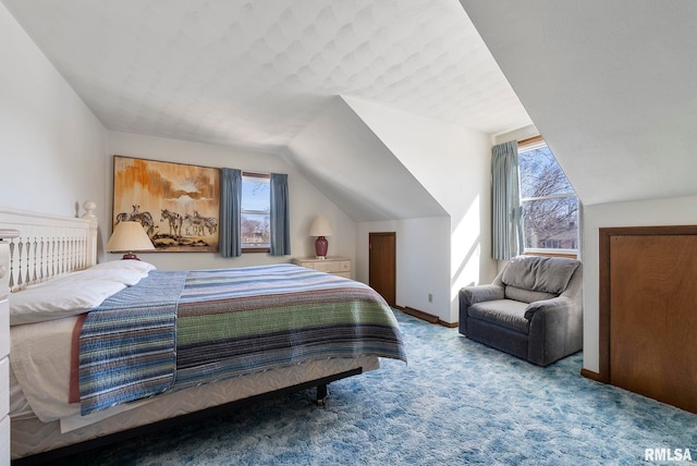 bedroom featuring carpet flooring, baseboards, and vaulted ceiling