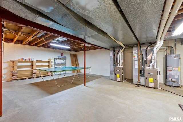 unfinished basement with gas water heater and heating unit