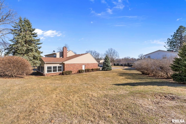 view of yard featuring a sunroom