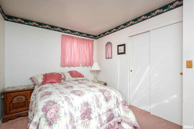 bedroom featuring a closet and carpet flooring