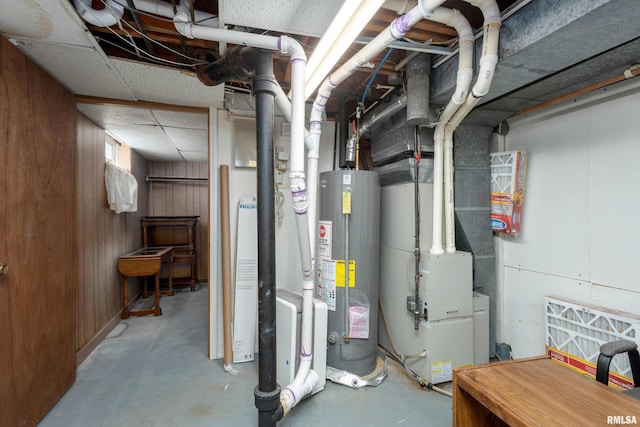 utility room with gas water heater