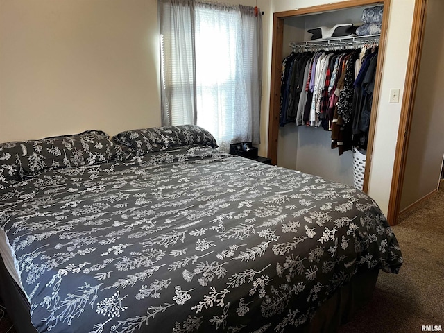 bedroom with a closet and carpet floors