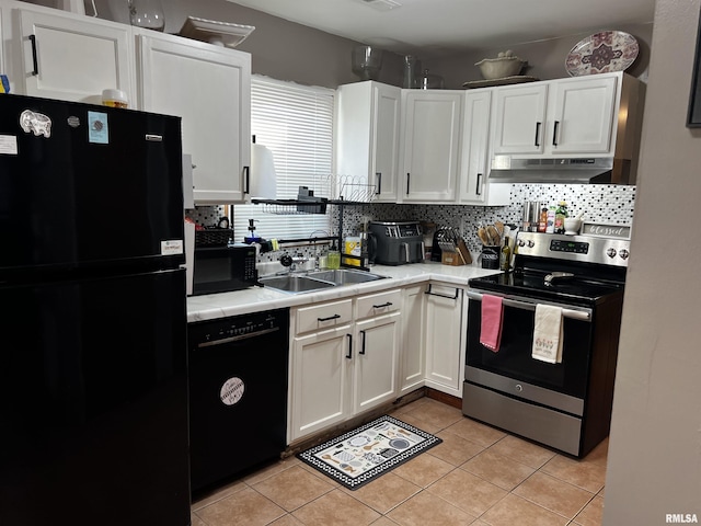 kitchen with black appliances, under cabinet range hood, decorative backsplash, white cabinetry, and a sink