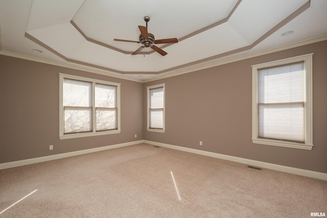 unfurnished room featuring light carpet, visible vents, and ornamental molding