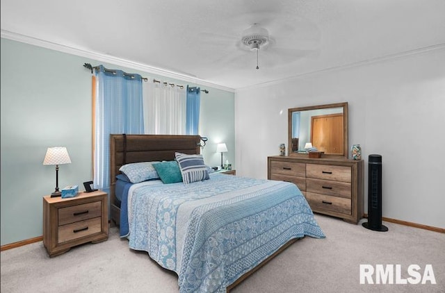 bedroom with light colored carpet, a ceiling fan, baseboards, and ornamental molding