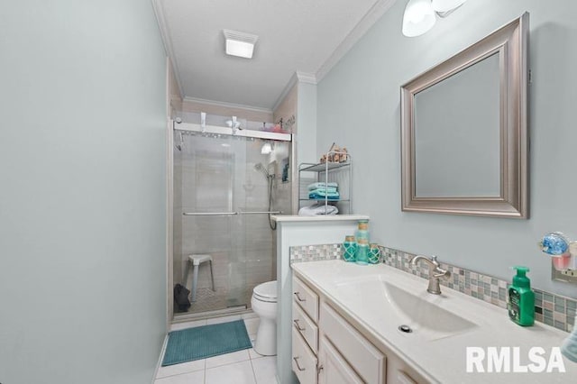 bathroom with toilet, a stall shower, crown molding, tile patterned flooring, and vanity