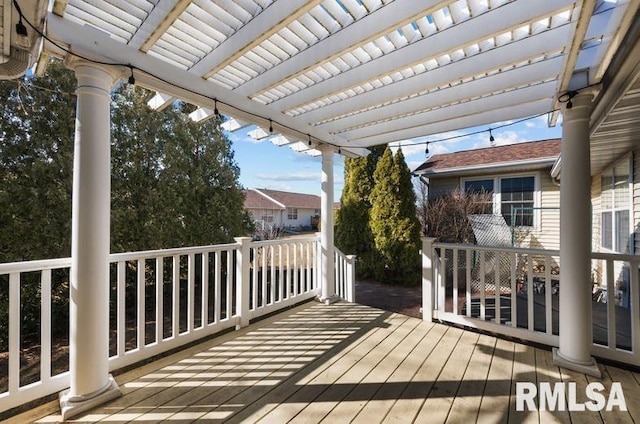 wooden deck with a pergola