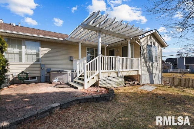 rear view of property with a patio area, fence, and a pergola