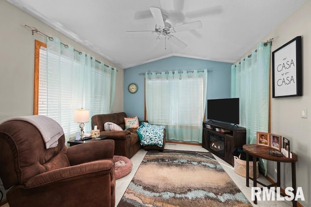 living room with lofted ceiling, carpet floors, and ceiling fan