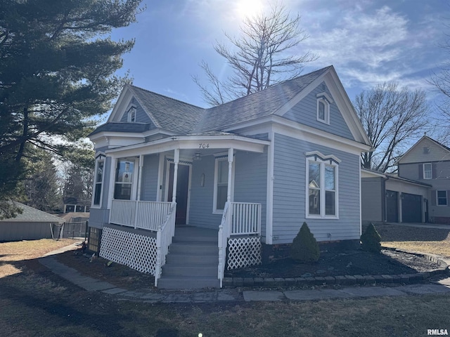 view of front of house featuring a porch and roof with shingles