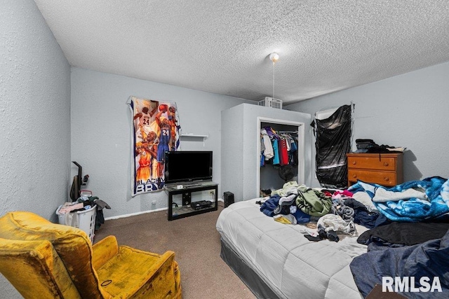 bedroom featuring a textured wall, baseboards, carpet floors, and a textured ceiling