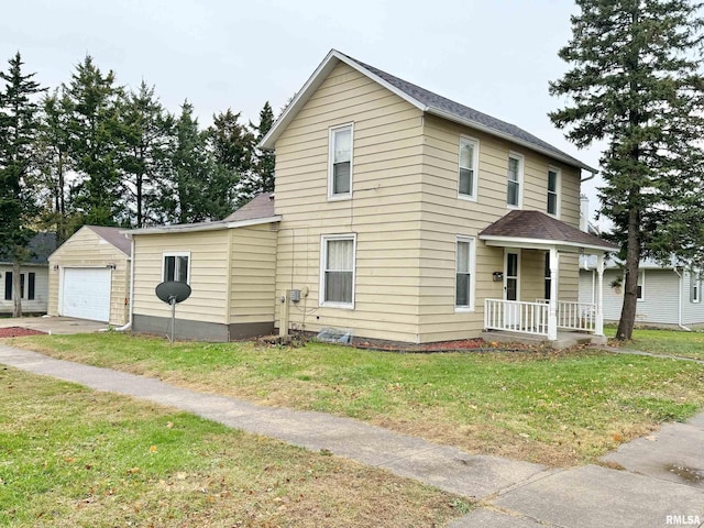 view of front facade featuring a garage, covered porch, a front yard, and roof with shingles