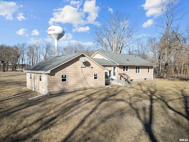 back of house with a yard