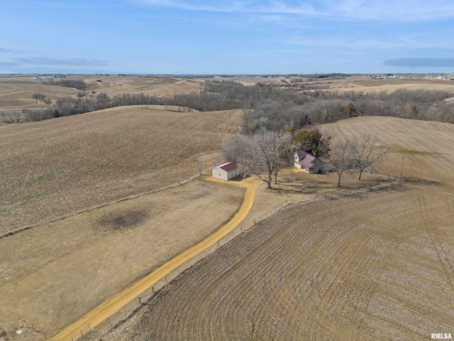 birds eye view of property featuring a rural view