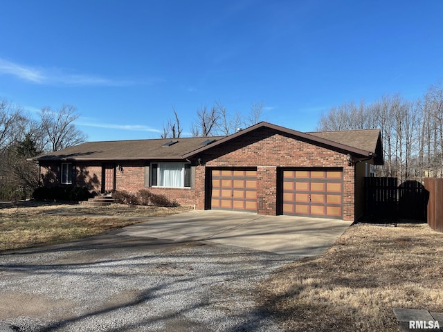 view of front facade with fence, an attached garage, a shingled roof, concrete driveway, and brick siding