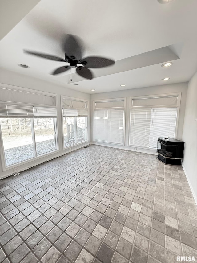 unfurnished living room featuring recessed lighting, baseboards, and ceiling fan