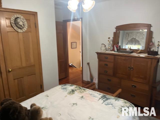 bedroom with wood finished floors