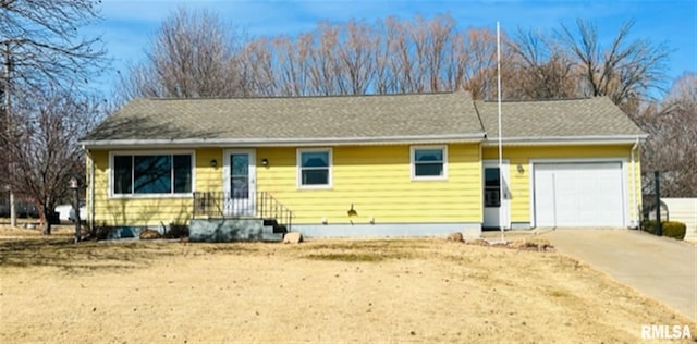 ranch-style house with driveway and a garage