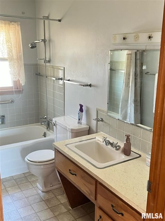 full bath with tile patterned flooring, tasteful backsplash, toilet, shower / tub combo, and vanity