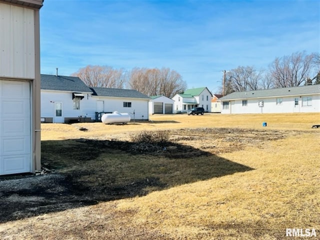 view of yard featuring a garage