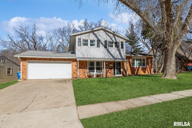 view of front of home with a front lawn, an attached garage, brick siding, and concrete driveway