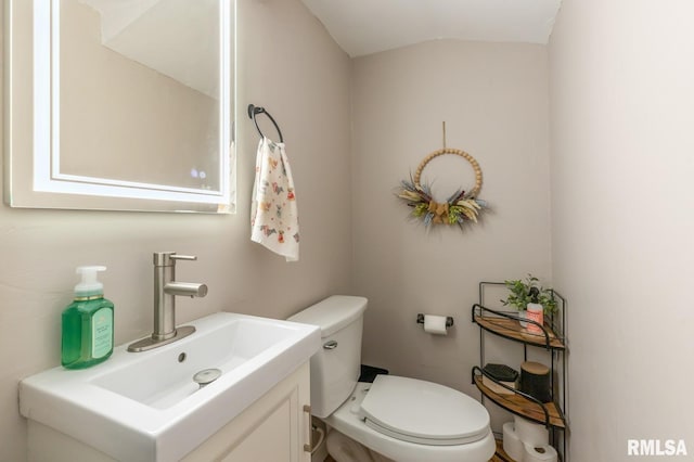 bathroom with toilet and vanity