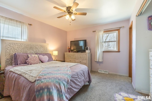 bedroom with visible vents, carpet flooring, a ceiling fan, and baseboards