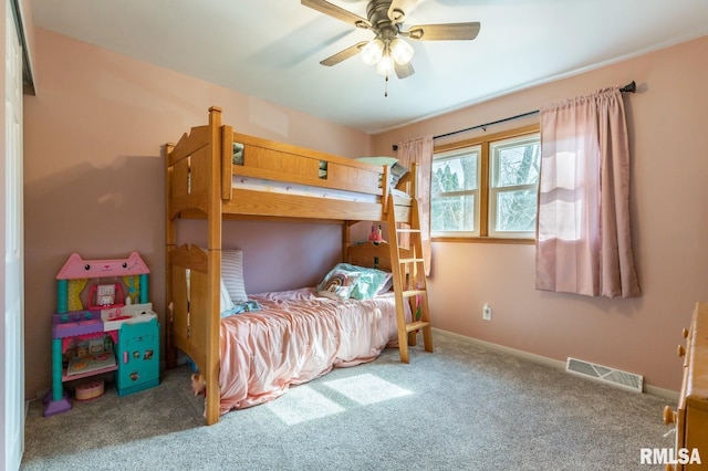 carpeted bedroom featuring visible vents, ceiling fan, and baseboards