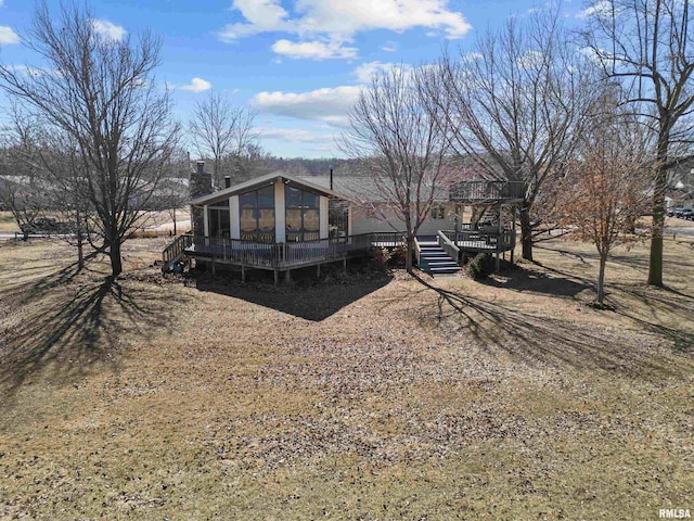 view of front of home featuring a deck and a chimney