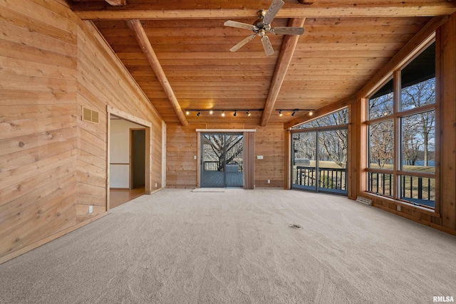 interior space featuring wooden walls, carpet floors, ceiling fan, track lighting, and wooden ceiling