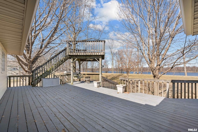 wooden deck featuring a water view