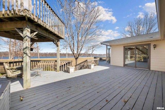 wooden deck featuring a water view