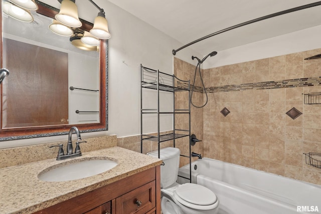 full bathroom featuring toilet, bathtub / shower combination, and vanity