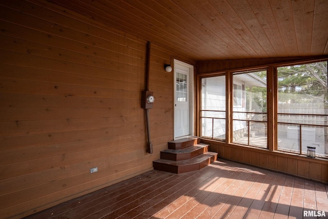 unfurnished sunroom with wooden ceiling