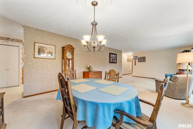 carpeted dining area featuring visible vents, an inviting chandelier, wallpapered walls, and baseboards