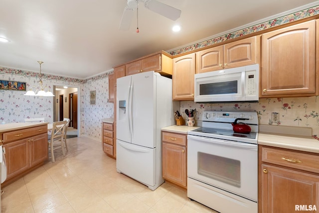 kitchen featuring white appliances, wallpapered walls, light countertops, pendant lighting, and ceiling fan with notable chandelier