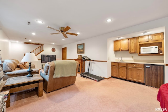 living area with visible vents, stairs, light carpet, recessed lighting, and a ceiling fan