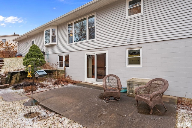 rear view of property featuring a patio