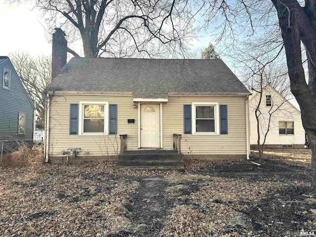 view of front of home featuring a chimney