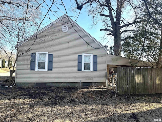 view of property exterior with fence