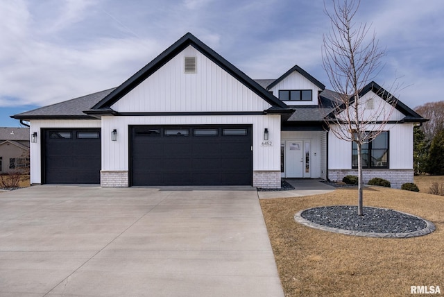 modern farmhouse style home featuring concrete driveway, an attached garage, brick siding, and a shingled roof