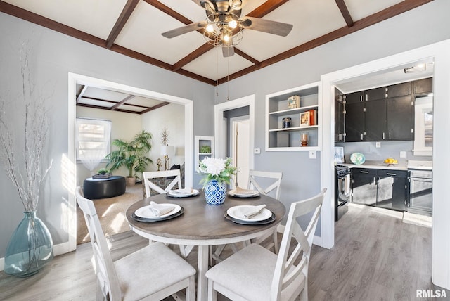 dining room with beamed ceiling, coffered ceiling, light wood-style flooring, and a ceiling fan